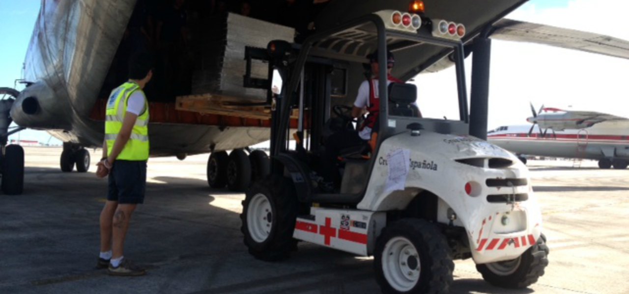 A forklift loads humanitarian aid into an Airbus A300F to assist with flooding in the Philippines in 2008