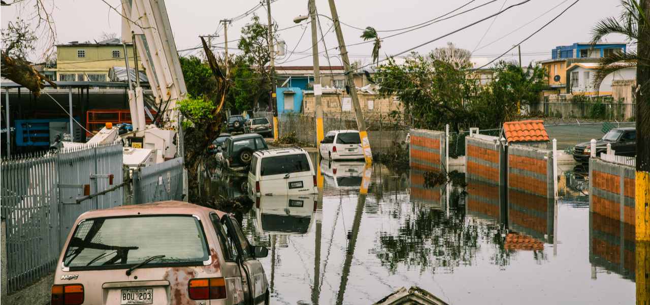 Cars lie half-submerged in the flooded streets of San Juan, Puerto Rico, after Hurricane Maria in 2017